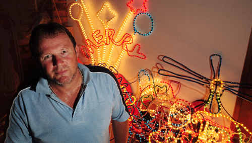 Good cause: Franco Devoti in his shed with a small selection of Christmas lights. Good cause: Franco Devoti in his shed with a small selection of Christmas lights.